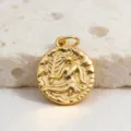 Gold coin pendant detail showing intricate antique relief figure and textured rim. - Virgo