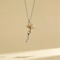 Detailed shot of the two-tone hugging couple pendant necklace, featuring minimalist silver-gold. - Style 10
