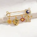 Gold safety pin charm pendant detail with evil eye, flowers, and crystal butterfly accents. - Style 5 (Pendant)
