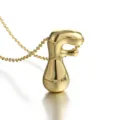 Close-up detail of a stylish gold-plated puffed letter F pendant necklace with fine chain. - Letter F