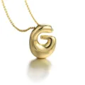 Close-up of a stylish puffed 3D letter G pendant necklace in glossy gold-plated finish. - Letter G