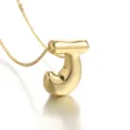 Detail shot of the gold plated puffy letter J pendant necklace showing exquisite texture. - Letter J