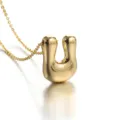 Gold plated puff letter U pendant necklace detail view, elegant jewelry accessory for women. - Letter U