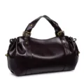 Detailed view of the dark brown soft leather retro handbag with metal buckles and side pleats. - Coffee