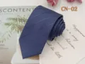 Detailed view of the dark blue striped business tie, showing fine jacquard texture and fabric. - CN-02