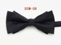 Detail shot of the black double-layer bow tie, classic solid color formal neckwear for men. - Black Twill