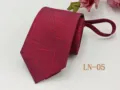 Detail view of a wine red men's zipper tie with abstract stripe pattern for business wear. - LN-05