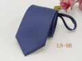 Blue striped zipper necktie detail close-up, showing fine woven jacquard texture and quality. - LN-06