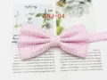 Detail view of the pink dotted bow tie texture, showcasing the fine fabric weave and neat folds. - SNJ-04