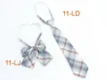 Closeup detail of Japanese JK uniform plaid bow and tie set in blue and grey tartan pattern. - Size 11
