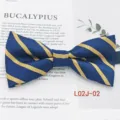 Detail view of a classic blue and yellow striped business casual men's fabric bow tie. - L02J-02