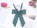 Dark green JK uniform bow tie with white polka dots, long strap student style accessory. - Dark Green