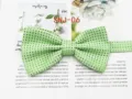 Close-up detail shot of green men's polka dot bow tie fabric texture and woven pattern. - SNJ-06