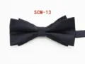 Detailed shot of a classic black double layer fabric bow tie for men formal business wear. - Black