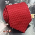 Detailed close-up view of a classic red jacquard patterned men tie on textured background. - Red Diamond (HCD-10)