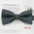 Detailed view of dark blue polyester jacquard striped bow tie for men business leisure use. - L02J-05