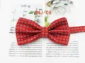 Red patterned polyester bow tie detail showing the exquisite geometric dot design for formal wear. - SNJ-08