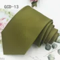 Close-up shot of the dark green classic solid color business necktie with fine texture. - Dark Green