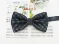 Classic navy blue men's bow tie with white polka dots, ideal for formal business suits. - SNJ-10
