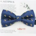 Detailed view of mens blue jacquard bow tie showcasing cute teddy bear and dot pattern. - L02J-11