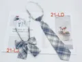 Close up of Japanese JK uniform blue plaid necktie and bow tie set detail display. - No. 21