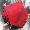 Close-up detail of red jacquard silk necktie with wave pattern, wedding groom accessory. - Red Wave Pattern (HCD-21)