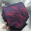 Navy blue men tie detail closeup featuring elegant red leaf jacquard pattern fabric texture. - Dark Blue with Red Pattern (HCD-22)