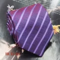 Detailed close-up shot of a purple men's woven jacquard tie featuring a classic striped pattern. - Purple Stripe (HCD-26)