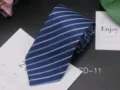 Close-up detail of men's business striped necktie in deep blue with light blue diagonal stripes. - CD-11