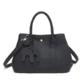 Black leather tote bag with elephant charm, casual shoulder crossbody bag variant. - Black