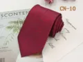 Burgundy men's necktie detail, featuring an abstract red and dark grey linear pattern design. - CN-10