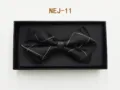 Detailed view of the black grid bow tie in a gift box, elegant design for formal menswear. - Black Plaid (NEJ-11)