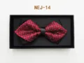 Detailed close-up of a red and black patterned bow tie neatly packed inside an elegant black gift box. - Red and Black Plaid (NEJ-14)