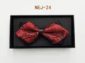 Red and black patterned bow tie detail with leather center knot in a black gift box. - Red and Black Brocade (NEJ-24)