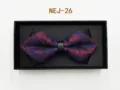 Detailed close-up view of the blue and red paisley bow tie featuring a black center strap. - Blue Base Red Floral (NEJ-26)