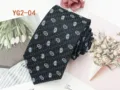 Close-up of black men necktie featuring elegant paisley jacquard pattern details. - YG2-04