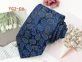 Detailed close-up of a blue paisley jacquard men necktie, elegant fabric texture design. - YG2-06