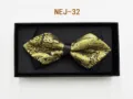 Detailed shot of a black and gold patterned bow tie in a gift box, elegant formal wear accessory. - Black and Gold European (NEJ-32)