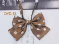 Detail view of brown double layer polka dot bow tie, JK uniform collar accessory. - DYD-12