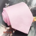 Pink ribbed men's necktie detail shot, elegant fabric texture for formal wear and business. - Pink (HCD-31)