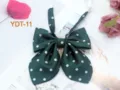 Detailed view of the dark green polka dot bow tie with white spots, cute JK accessory. - Dark Green