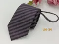 Detailed view of dark purple striped zipper tie with jacquard texture close-up shot. - LN-34