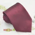 Detailed view of wine red men's necktie, elegant jacquard fabric for wedding and formal wear. - Burgundy (HCD-36)