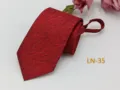 Detailed view of the red jacquard woven men's zipper tie showing fine textured pattern. - LN-35
