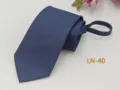 Close-up view of the dark blue zipper necktie, showing the textured fabric detail clearly. - LN-40