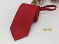 Detail view of red men's zipper tie, textured jacquard fabric, easy-pull neckwear accessory - LN-42