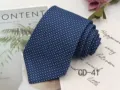 Detailed close-up of blue jacquard men business necktie, fine woven dot pattern, professional style. - CD-41
