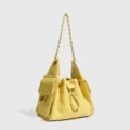 Yellow quilted leather bucket shoulder bag with chic chain strap and secure drawstring closure. - Yellow Square Buckle