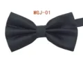 Detailed close-up of the black textured magic cube grid bow tie, showing fine fabric weave. - MGJ-01 Black