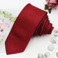Detail view of men's red narrow necktie with black fine stripes, ideal for business wear. - Wine Red Wide Stripe